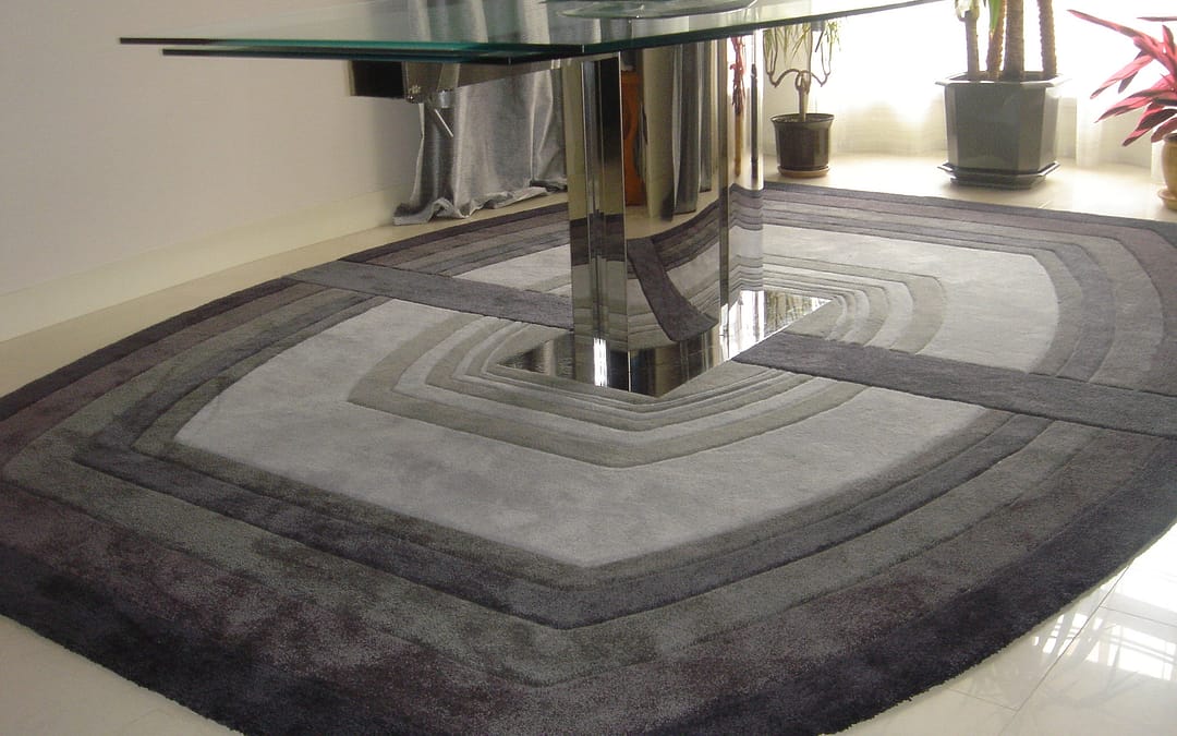 Split rug 10 shades of grey under glass table in interior
