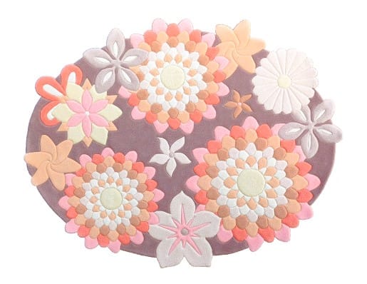 Handmade oval rug in warm tones with floral pattern – full image