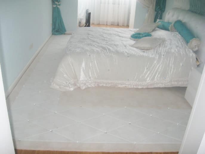 Custom bedroom rug with Swarovski crystals, fitted to room layout and color scheme
