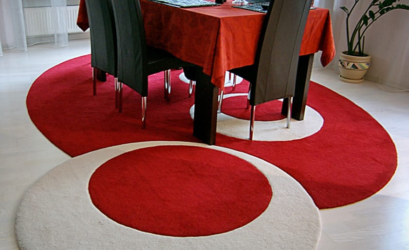 Oval contemporary rug white-red in the living room interior
