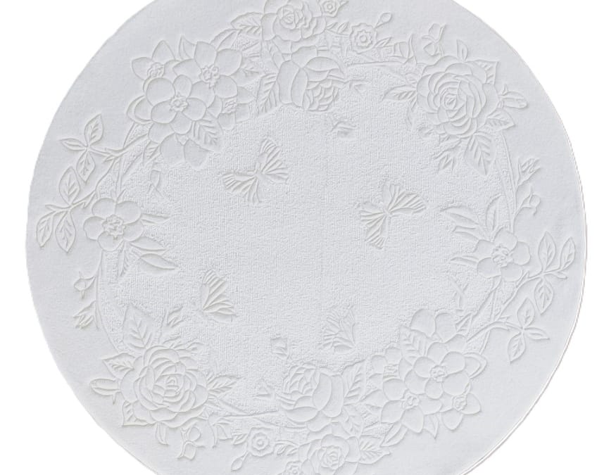 Round white carpet with two textures and relief floral pattern